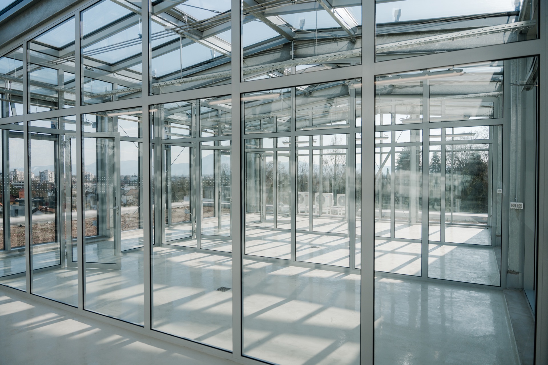 Glazed rooftop interior with steel framing